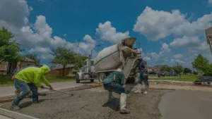 Pouring concrete on site for a driveway at a North Texas based home